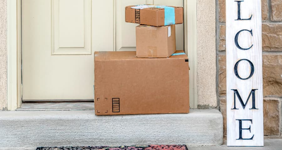 Deliveries on the front porch of a house with a welcome sign in Jonesboro